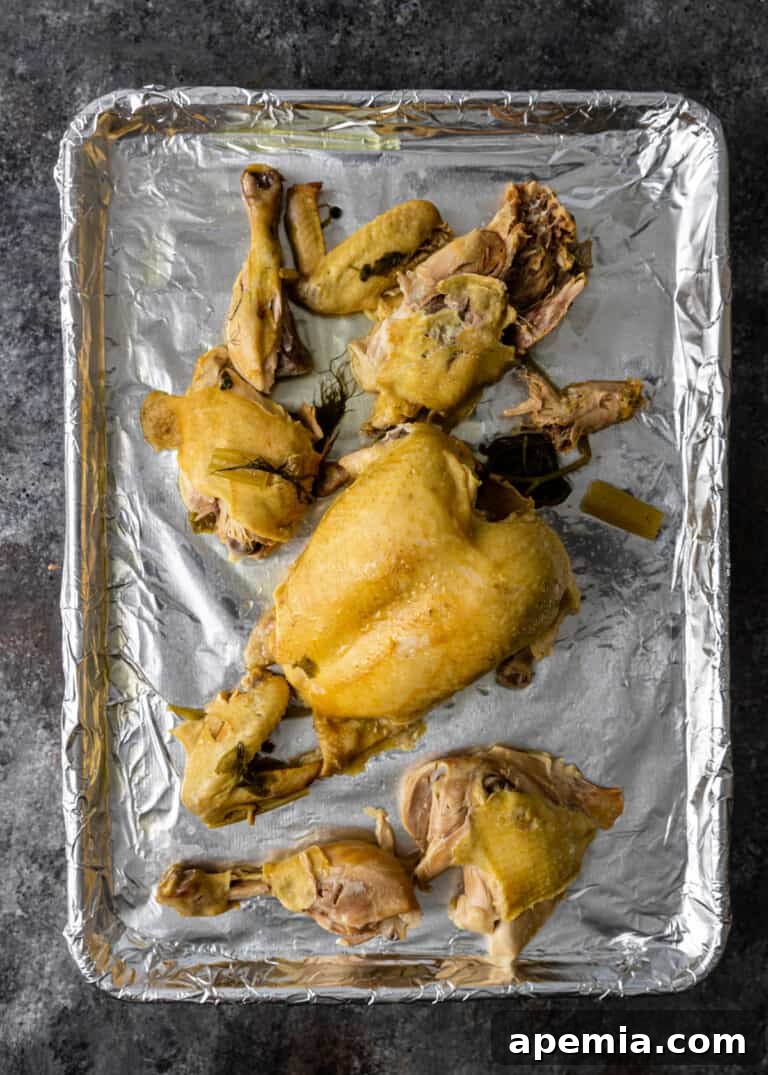 overhead process shot: cooked whole chicken cut into sections