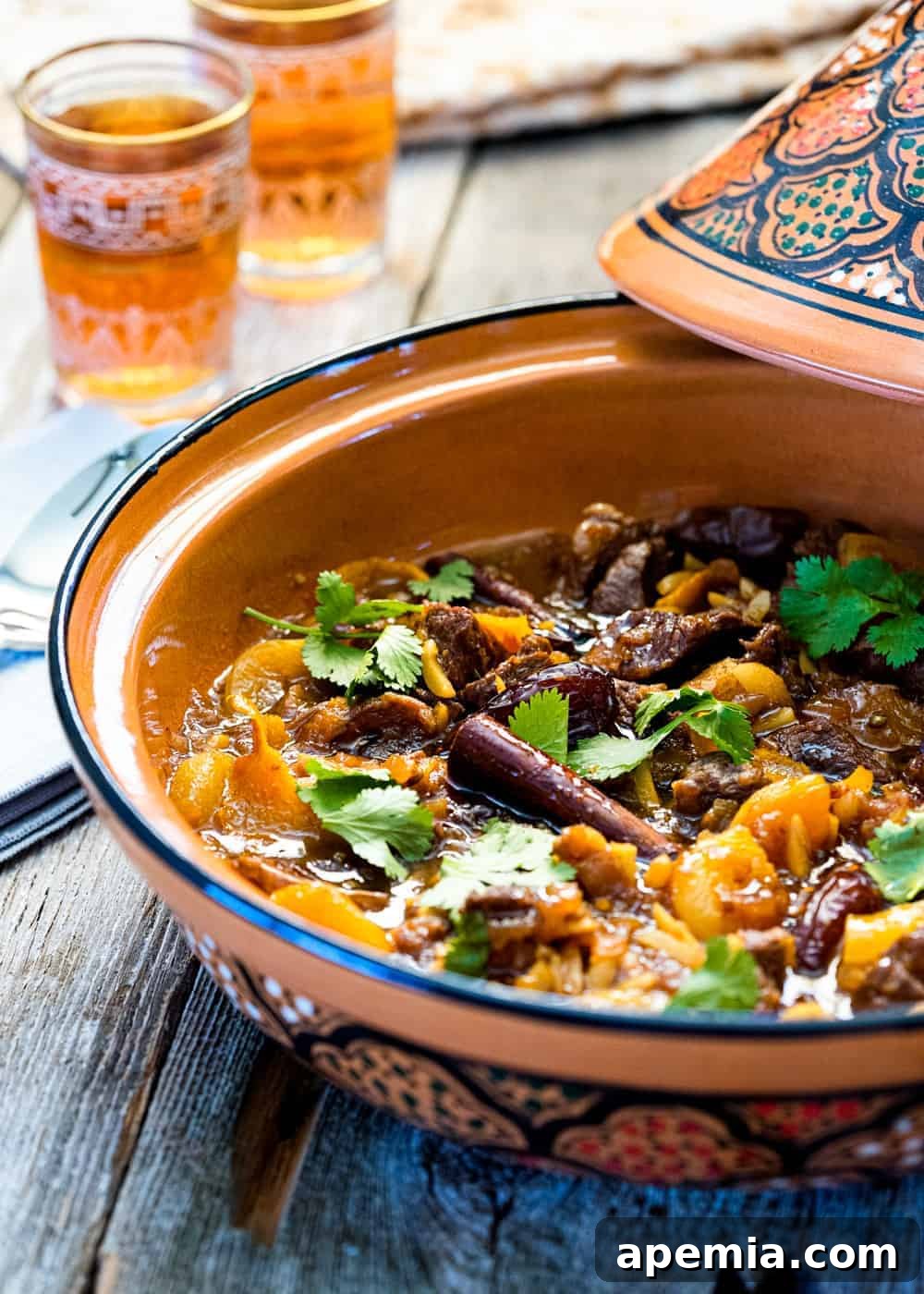 lamb tagine with apricots and dates in large clay pot