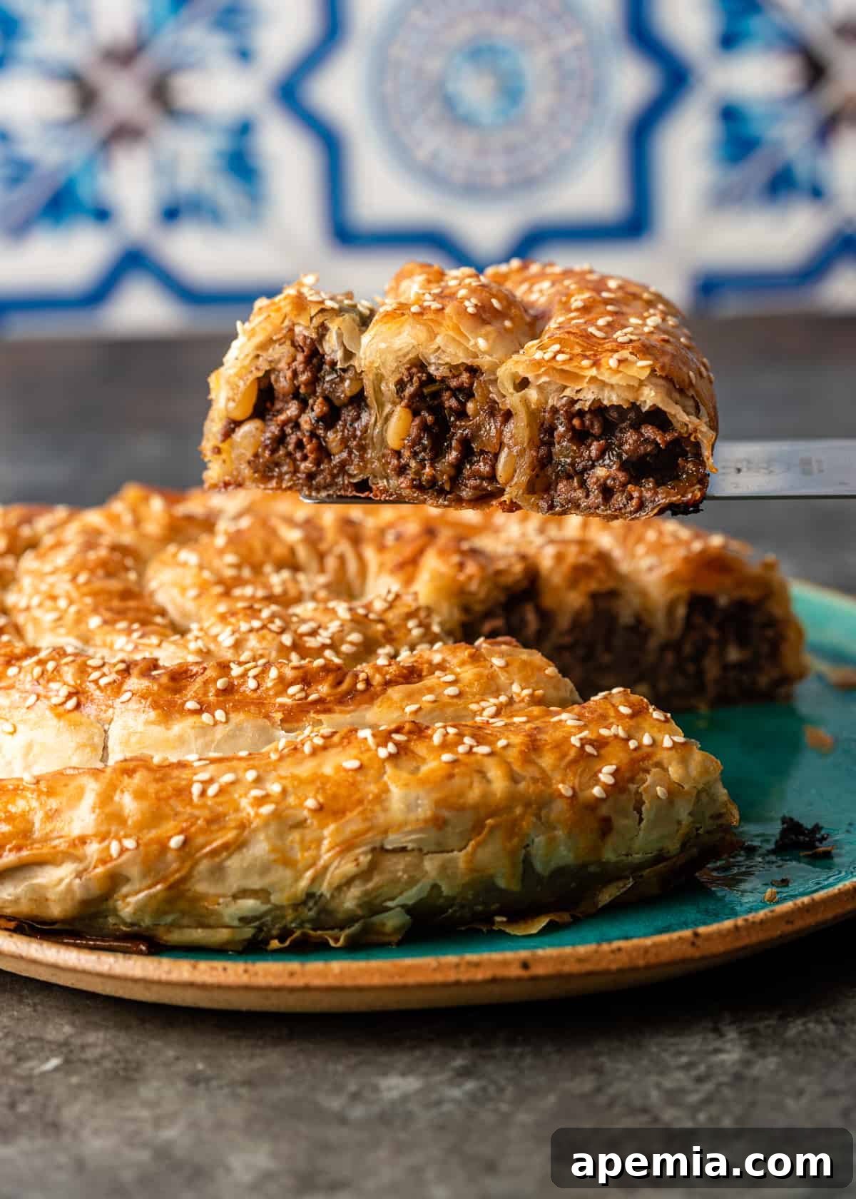 side view: lifting a slice of my borek recipe with the meat filling showing