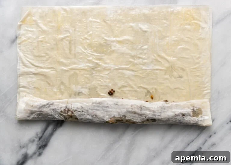 overhead process shot: rolling savory filled pastry for bourekas