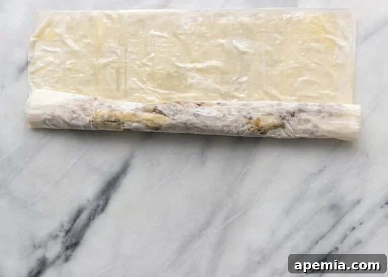 overhead process shot: rolling up the meat filled pastry