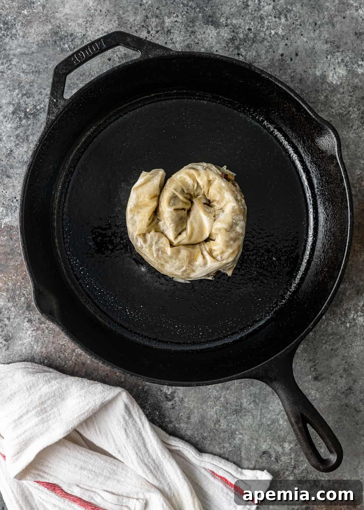 overhead process shot: adding borek to a skillet