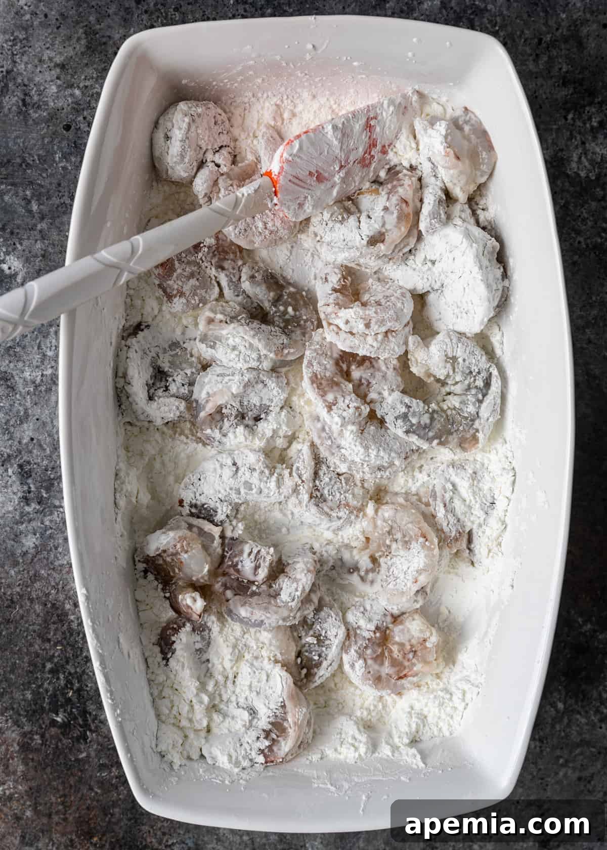overhead process shot: coating shrimp in cornstarch