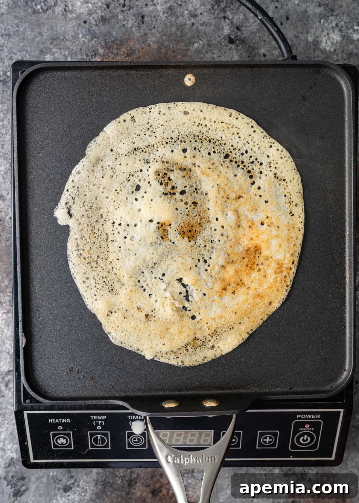 overhead: freshly cooked dosa on a griddle
