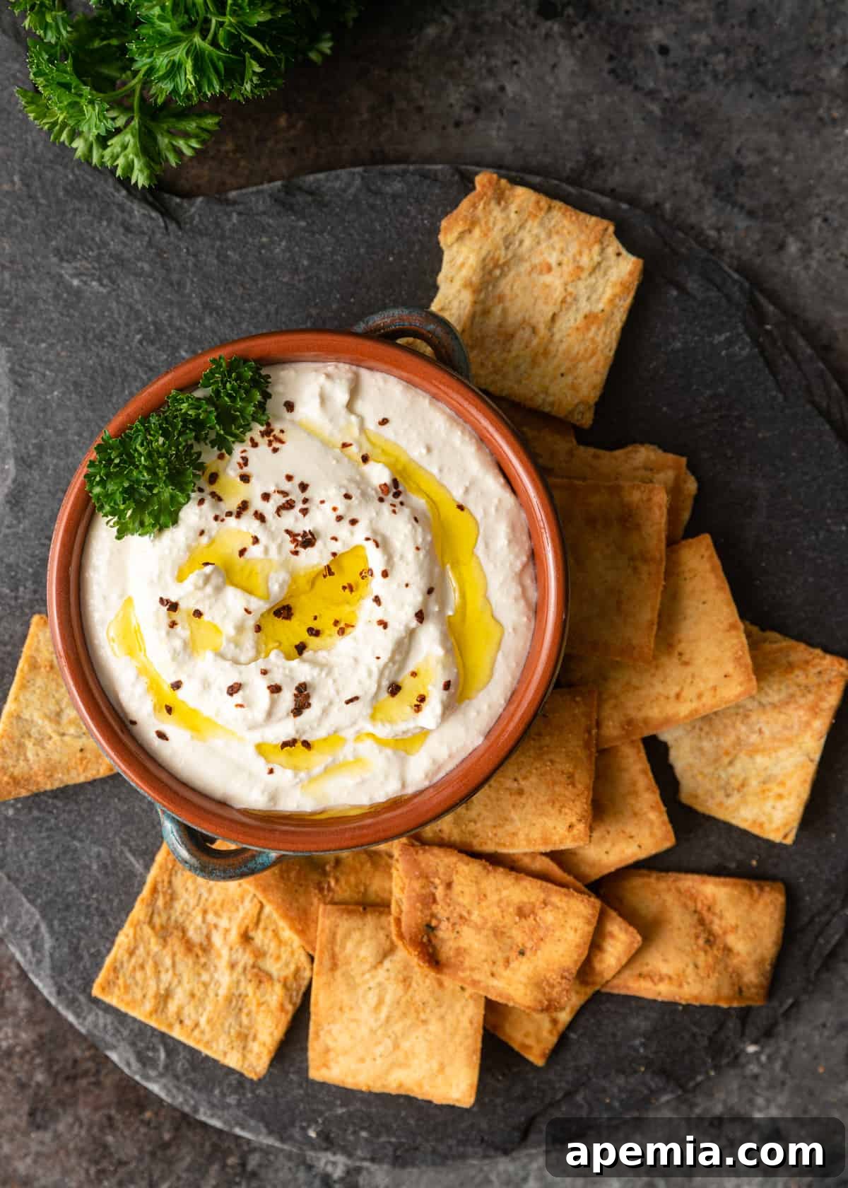 overhead: whipped feta with pita chips on side