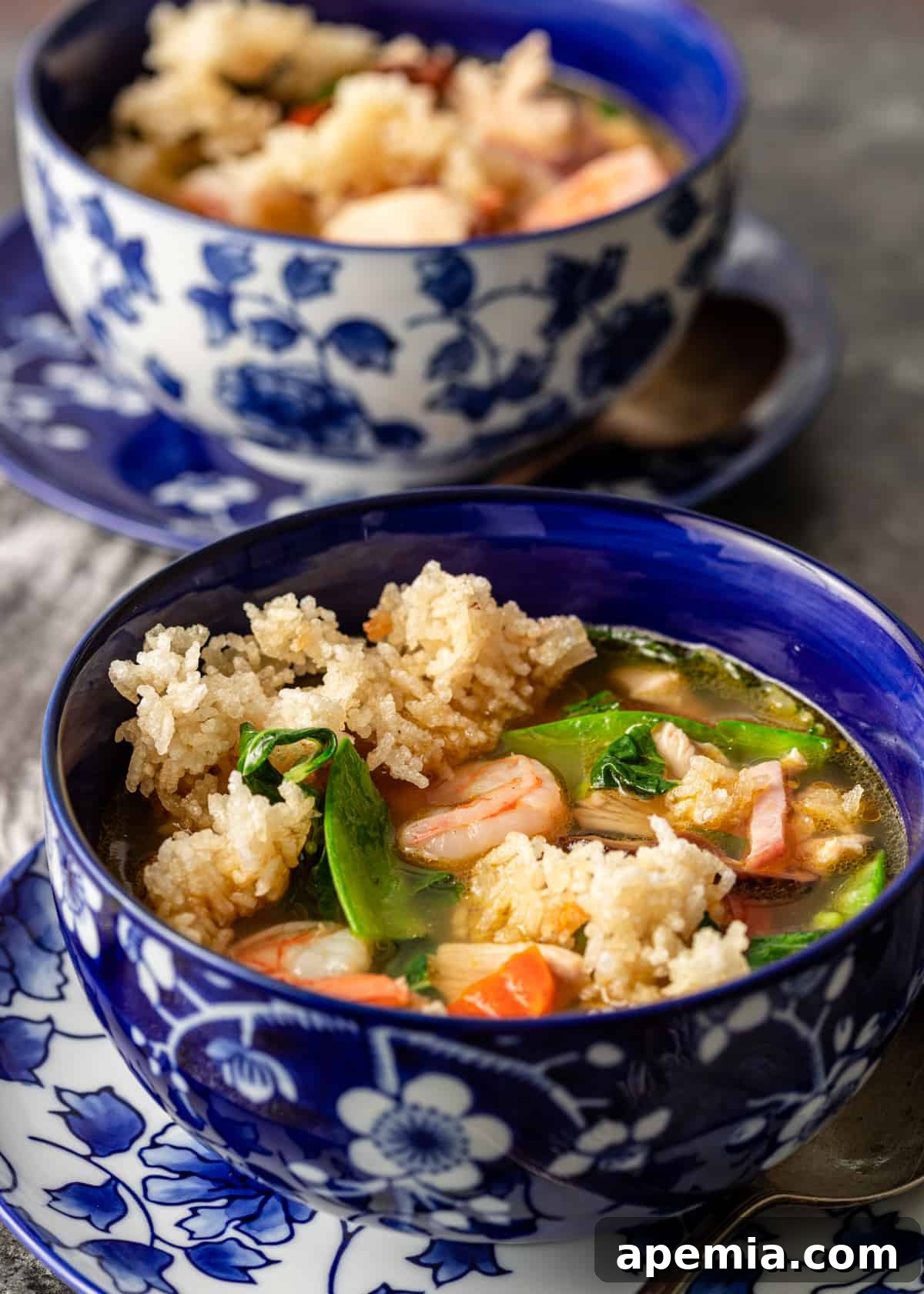 Two enticing bowls of homemade Sizzling Rice Soup, ready to be enjoyed