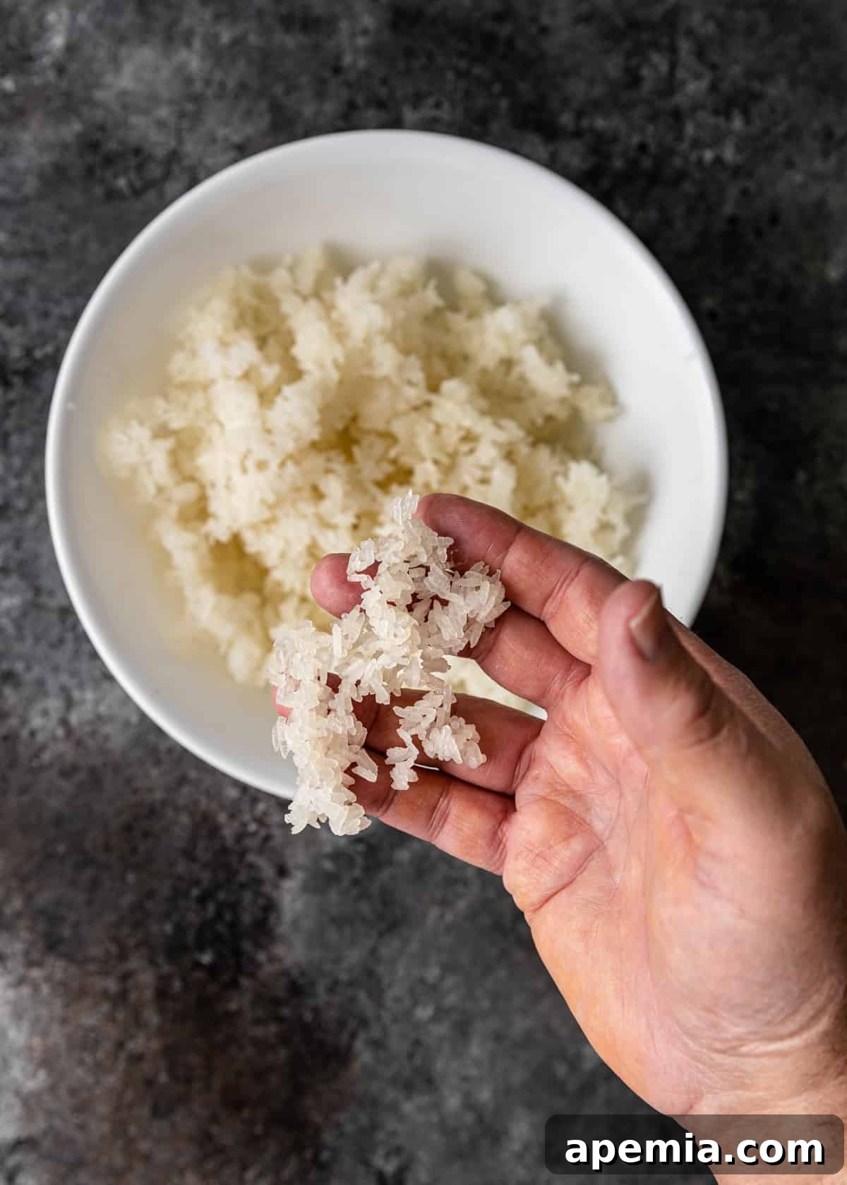 Overhead shot of rice baking in an oven until perfectly dried for sizzling rice soup