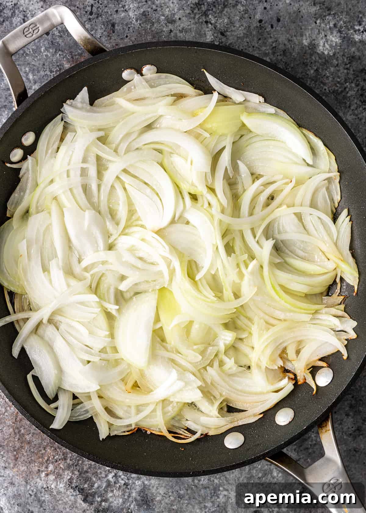 overhead process shot: onions in a skillet