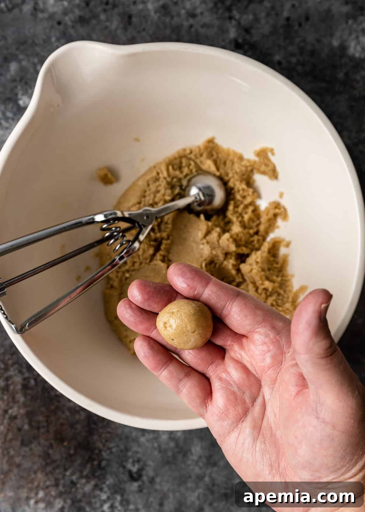 overhead process shot: rolling cookie dough in hands