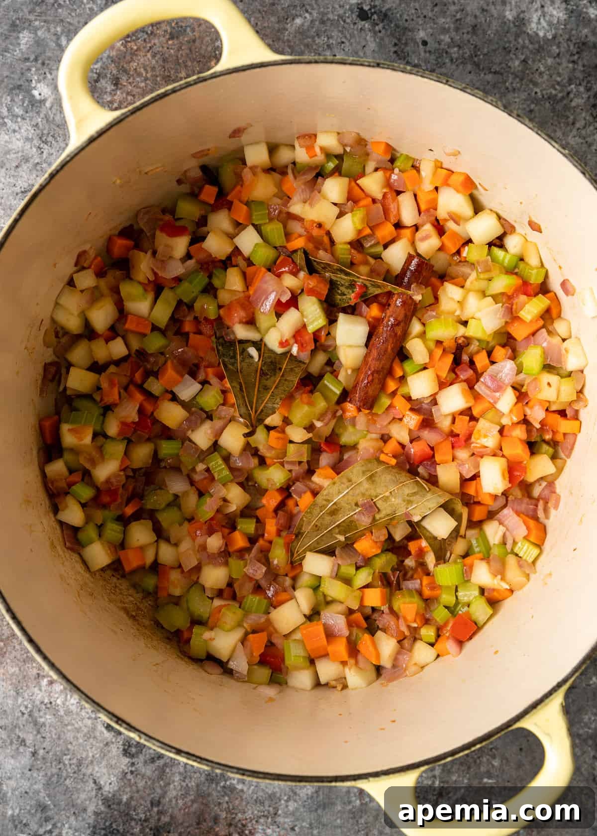overhead process shot: titled image (and shown) add vegetables and apple
