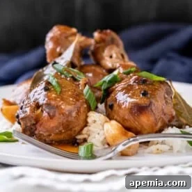 Filipino Chicken Adobo - Savory and fall-off-the-bone tender chicken slow-braised in a rich sauce of soy sauce, vinegar, garlic, and pepper.