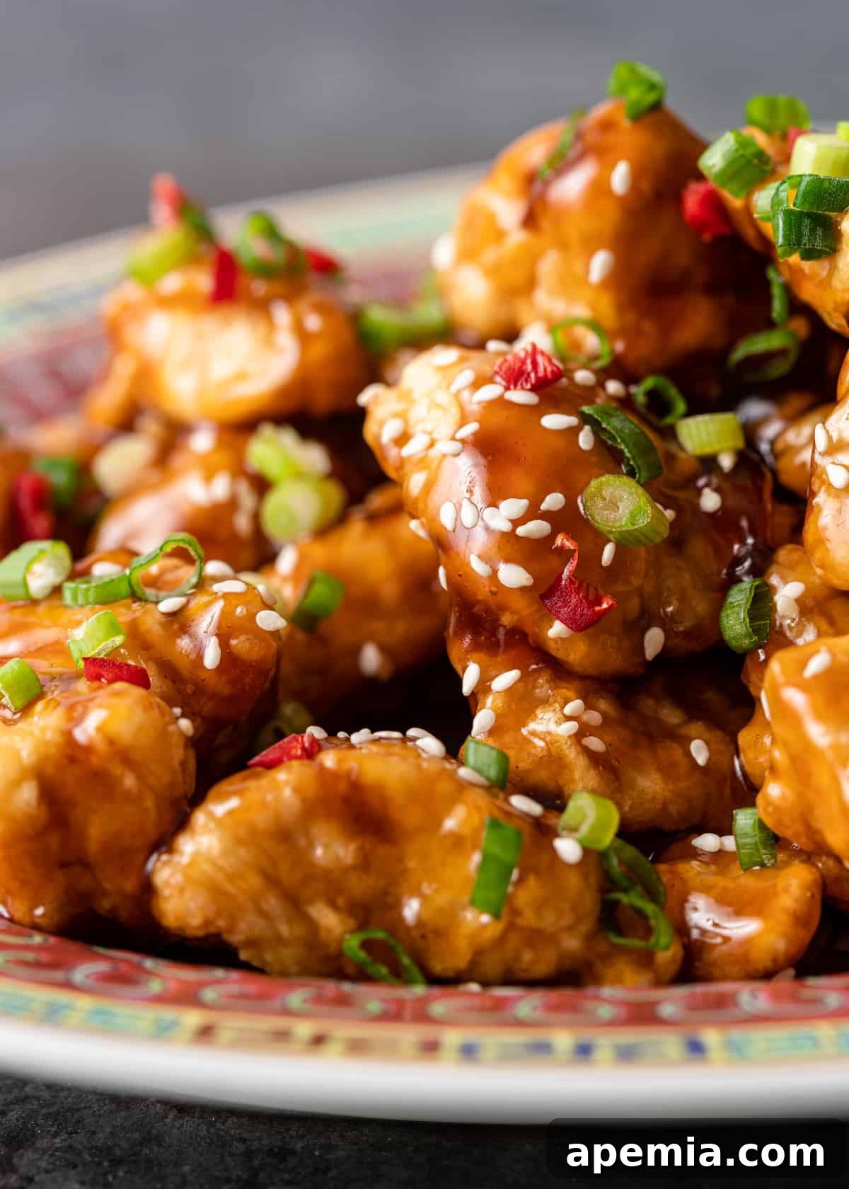 extreme closeup side view: ready to serve honey chicken