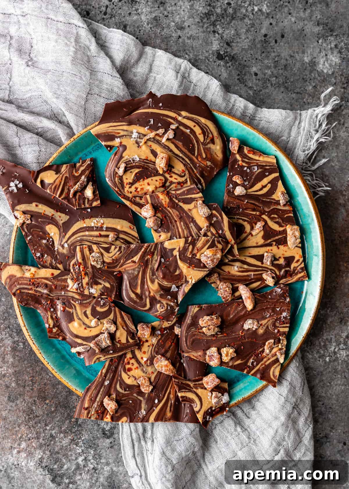 Overhead view of a blue platter showcasing the finished Tahini Chocolate Bark, ready to be enjoyed as a delightful no-bake dessert.