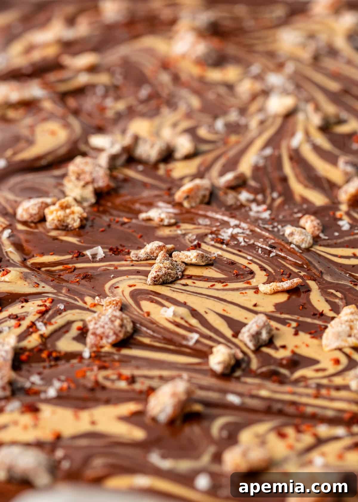Close up of melted dark chocolate and tahini mixture, ready for swirling into bark.