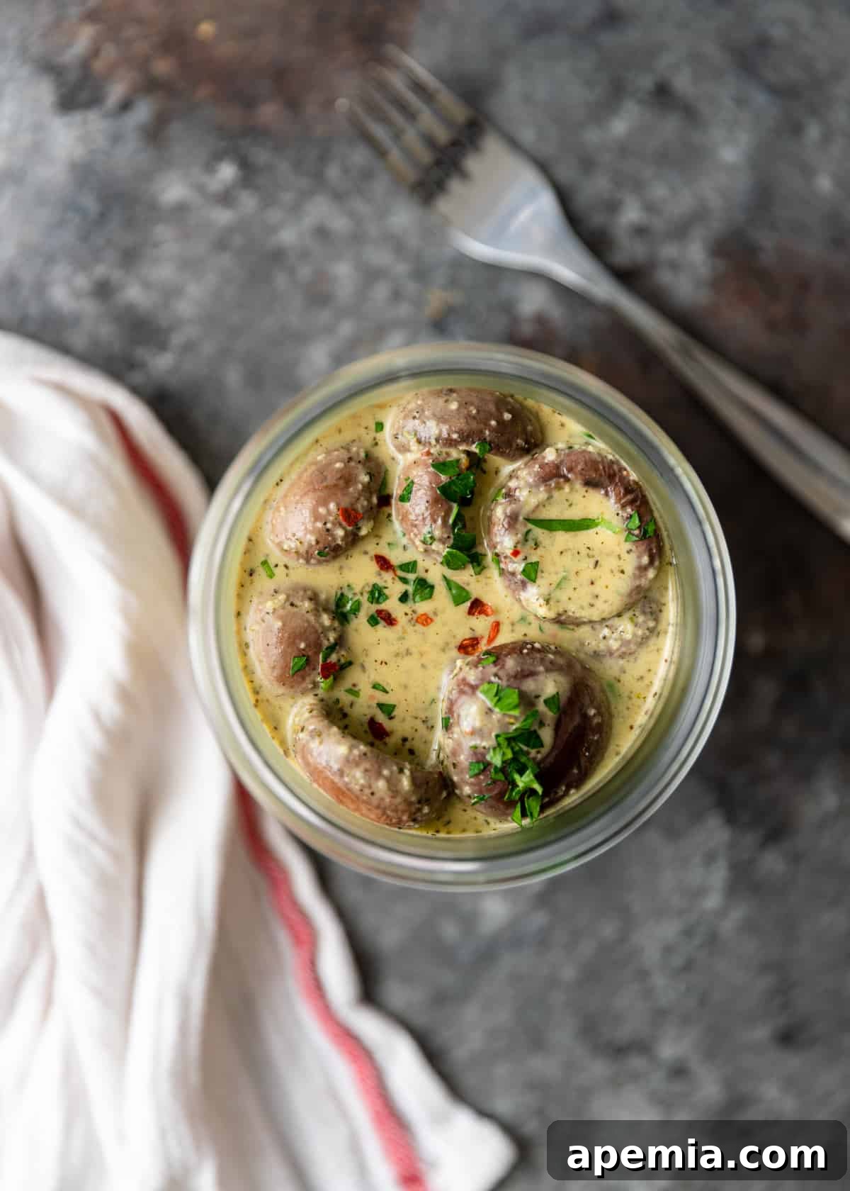 overhead shot of Marinated Mushrooms in a jar
