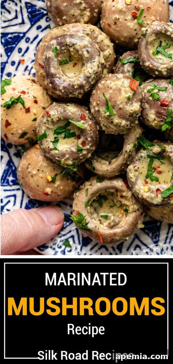 overhead shot of Marinated Mushrooms on a blue plate