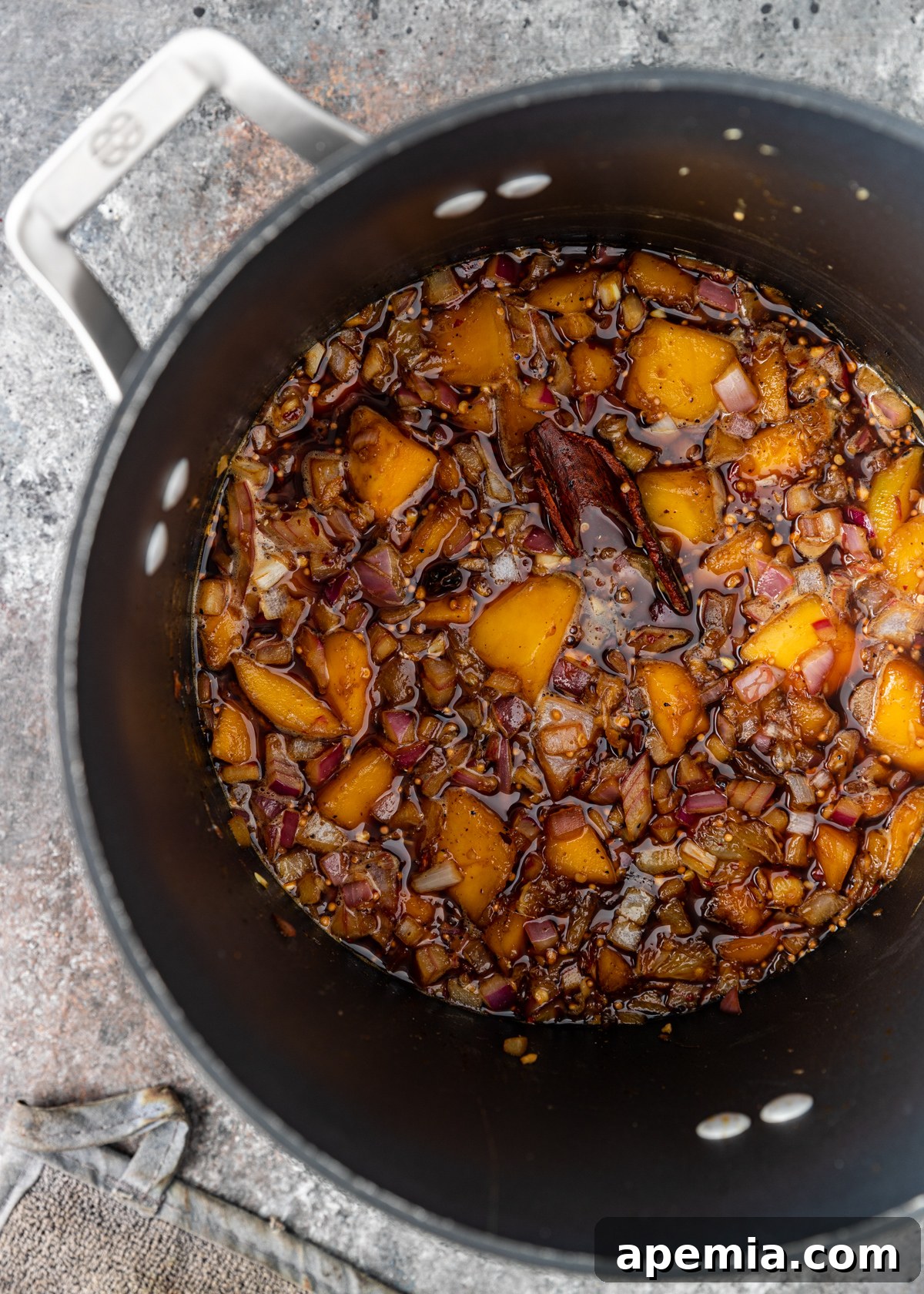 Mastering Major Grey Chutney 5 Ingredients for Major Grey Chutney simmering in a deep pot on the stovetop