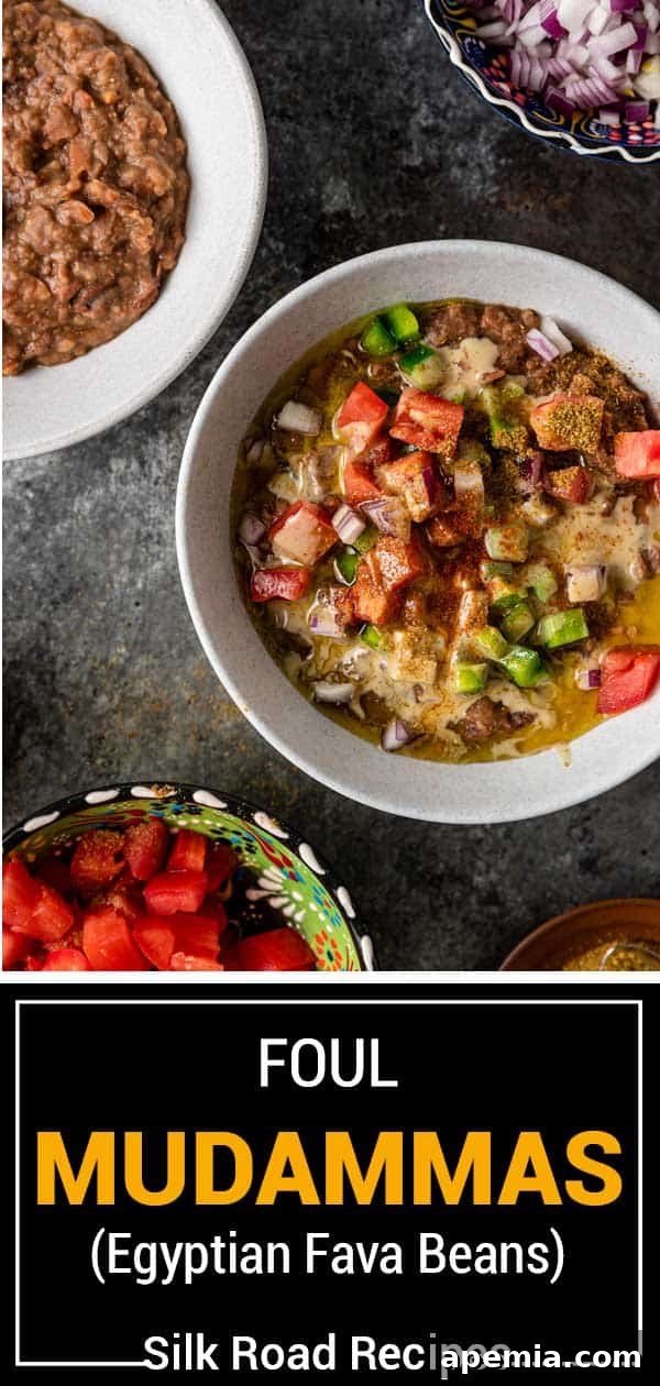 overhead of bowl of ful with toppings