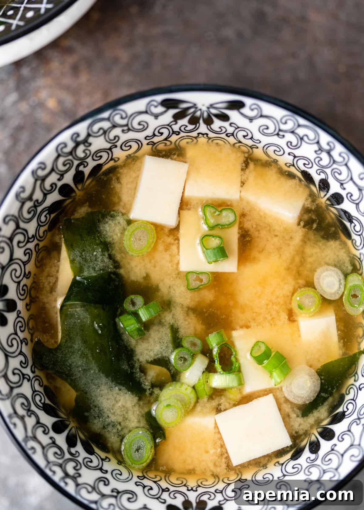 Simple Japanese Miso Soup 8 miso soup in a black and white bowl