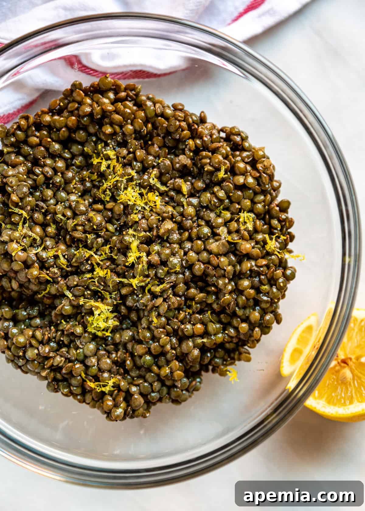 lemon zest in bowl with green lentils