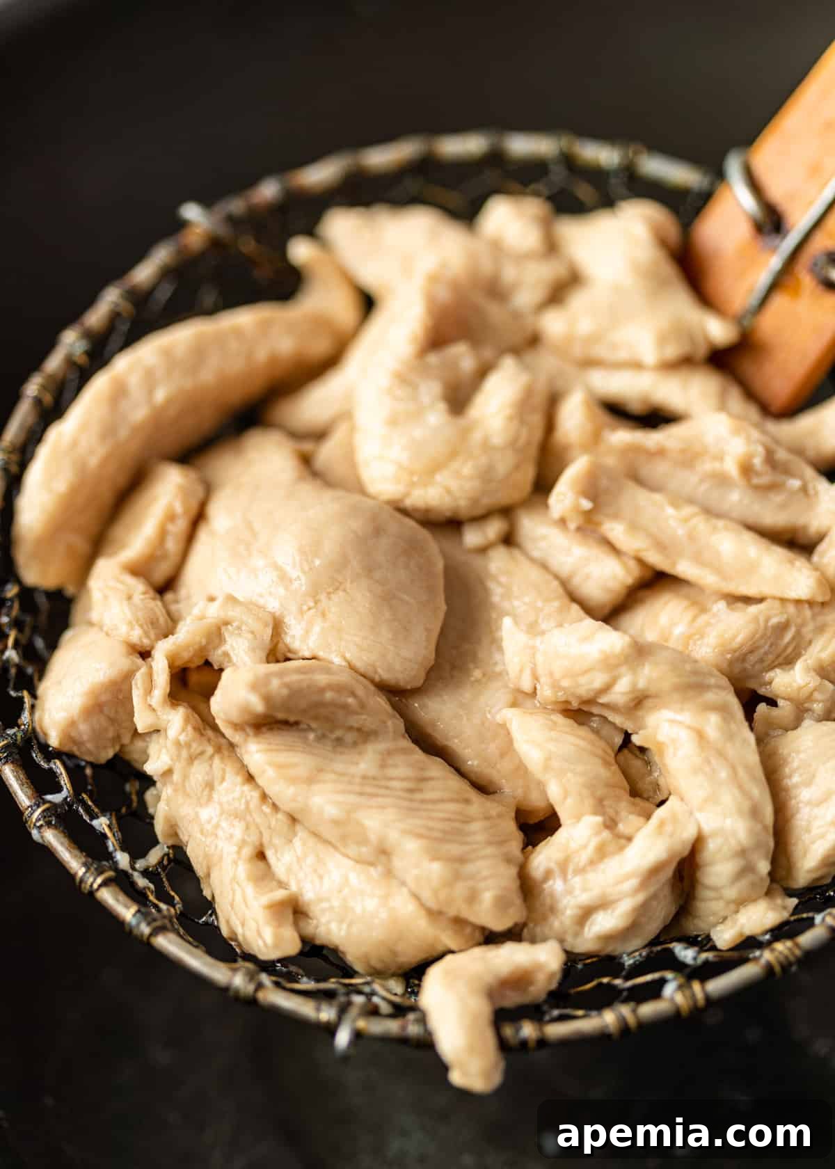 Close-up view of perfectly cooked, tender chicken pieces.