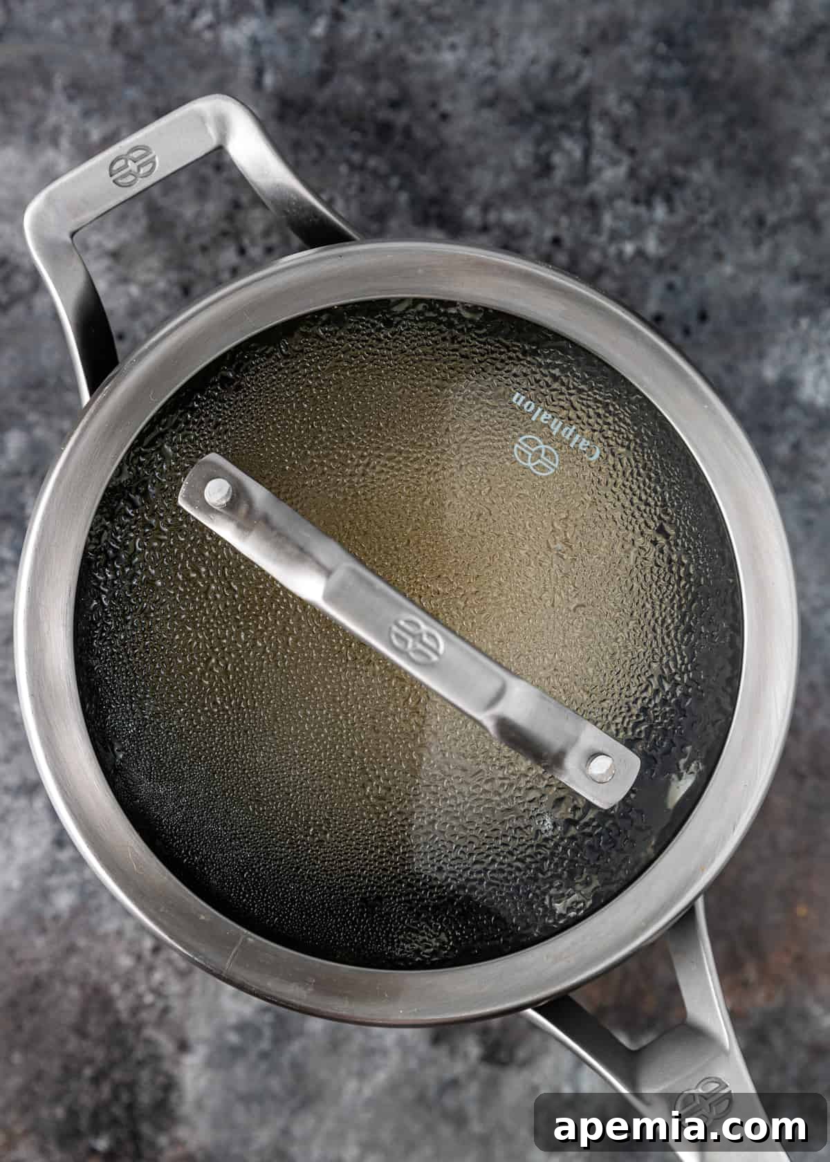 pan of steaming rice with a lid