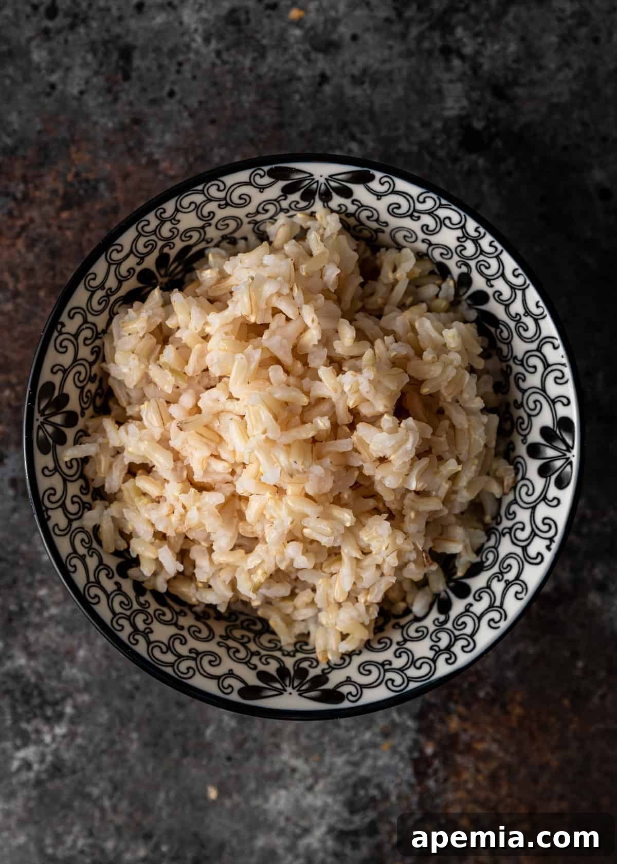 black and white bowl with cooked brown rice