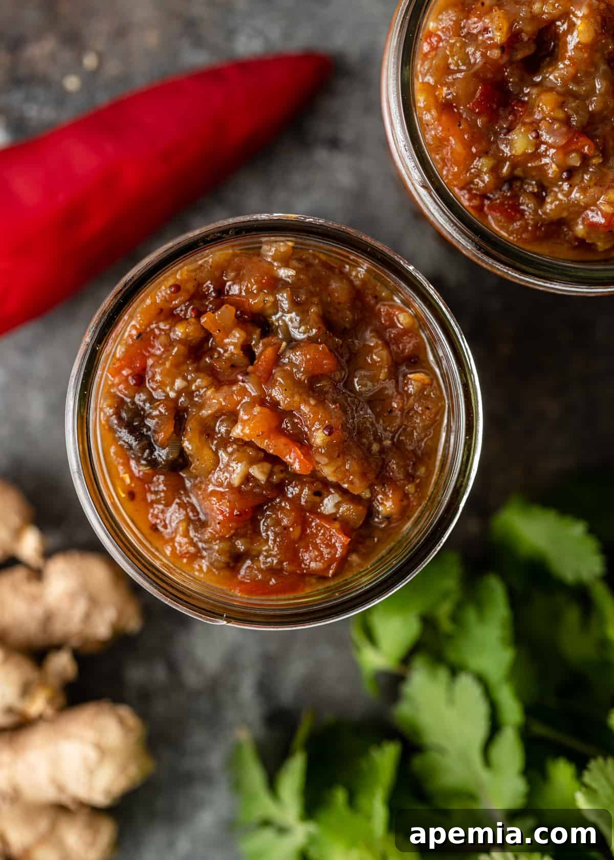 Sweet Heat Tomato Chutney 3 Overhead shot of a clear jar filled with homemade tomato chutney, showcasing its beautiful color and texture, ready for storage.