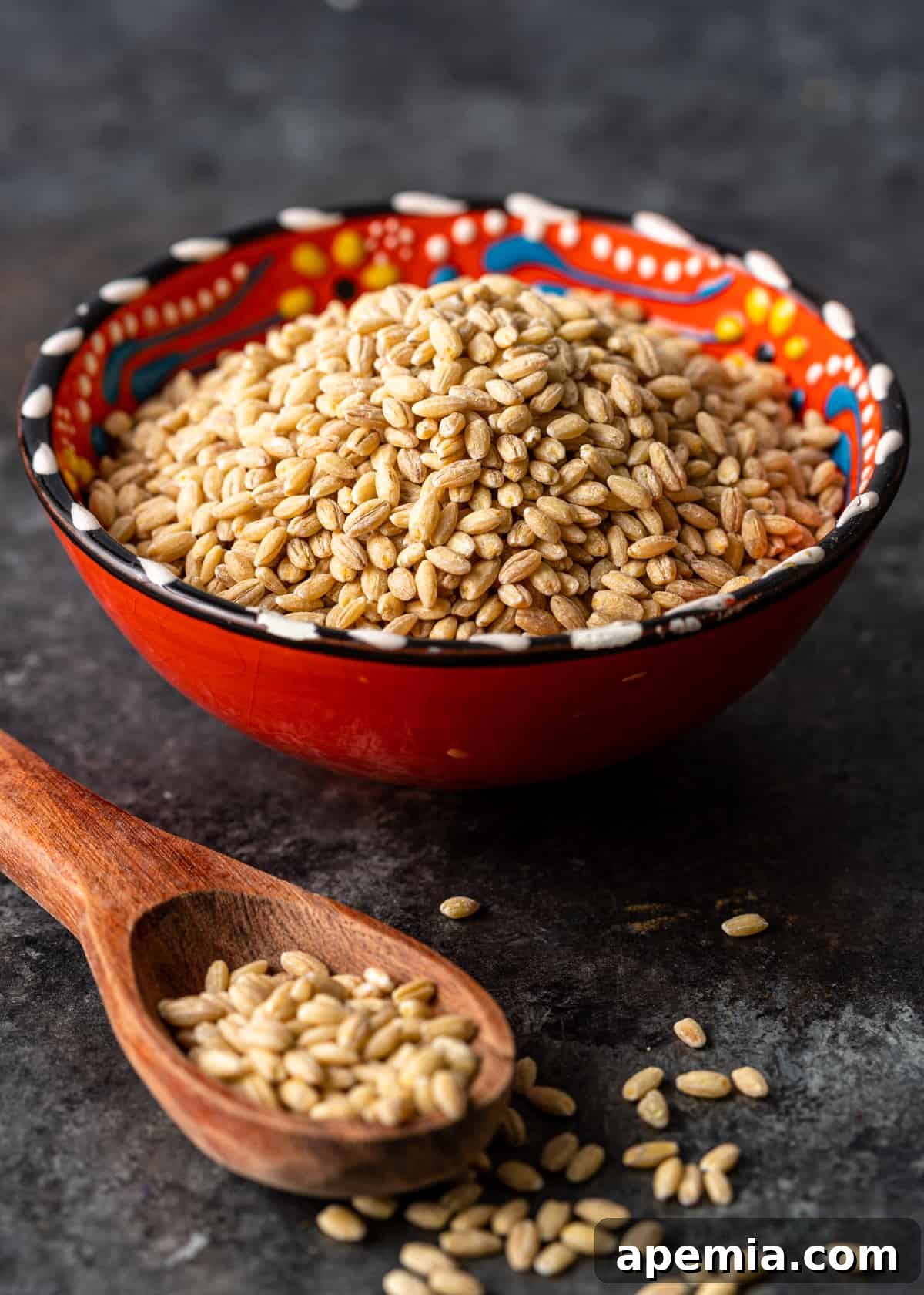 pearled barley in bowl with spoon