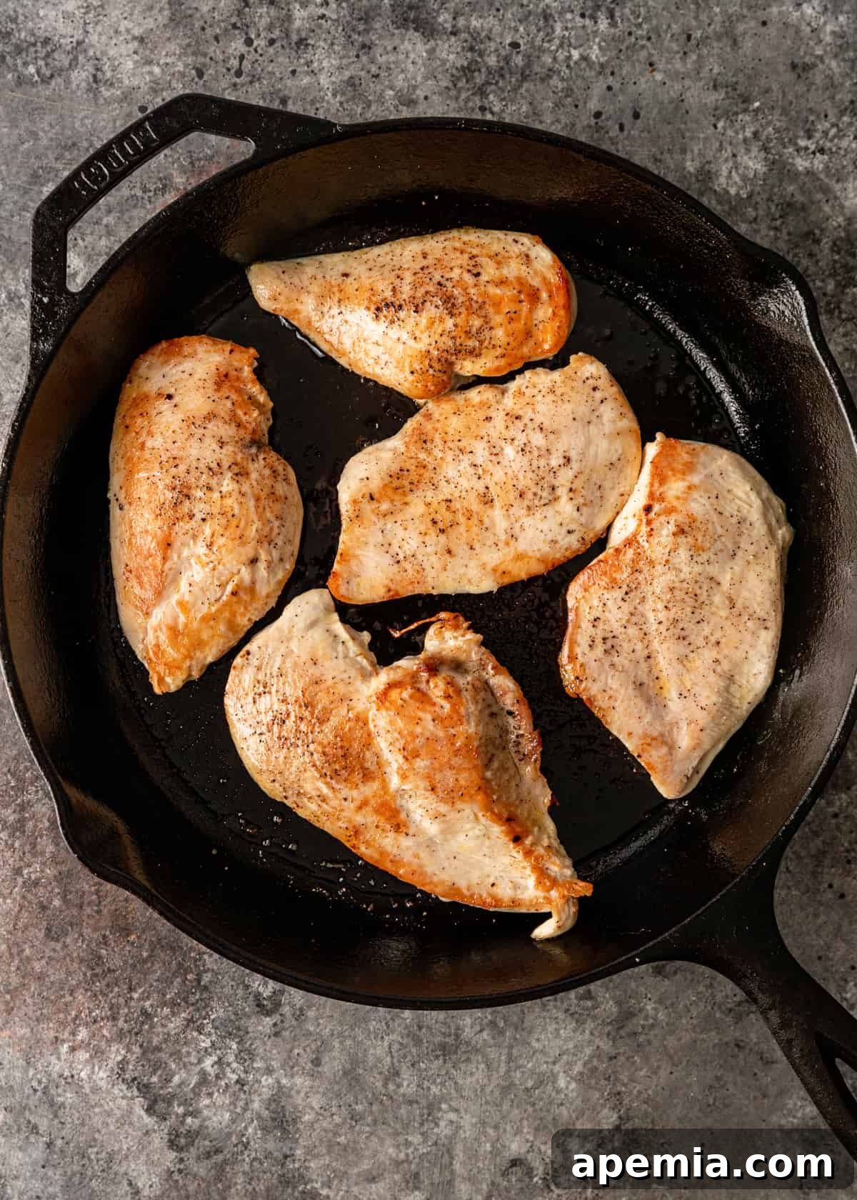Chicken browning in a skillet