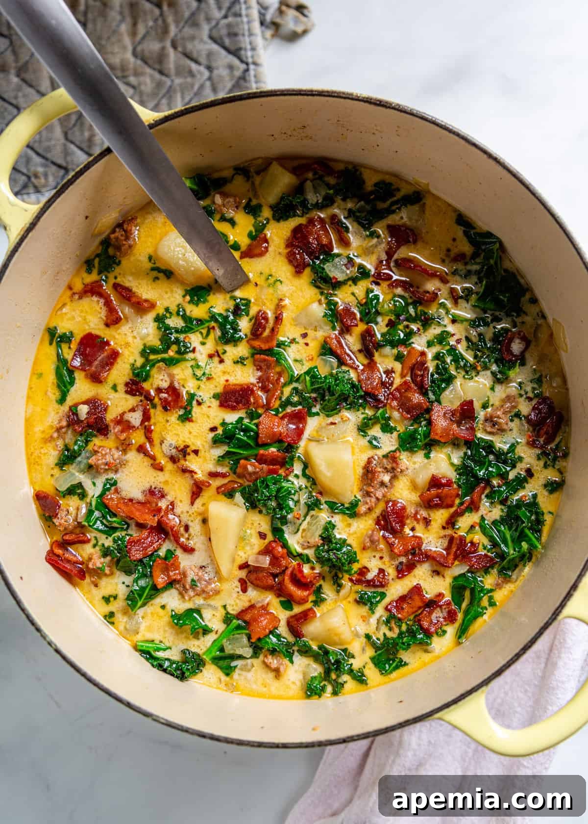 A pot full of zuppa toscana cooking