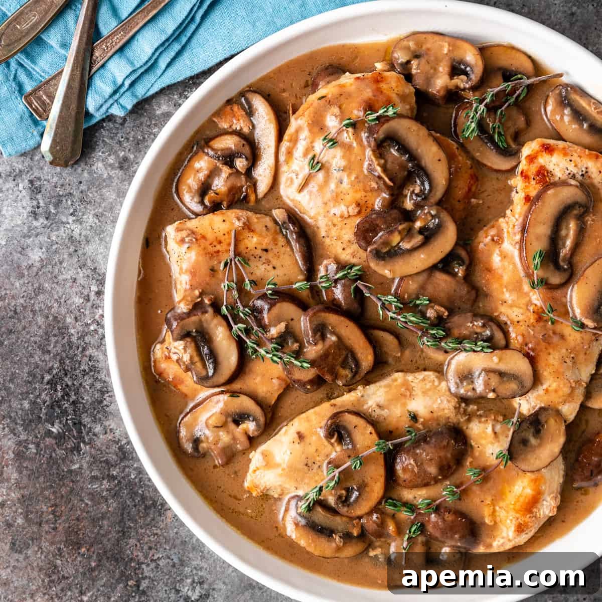 Rich and Creamy Marsala Chicken 2 overhead shot of Chicken Marsala in a white dish