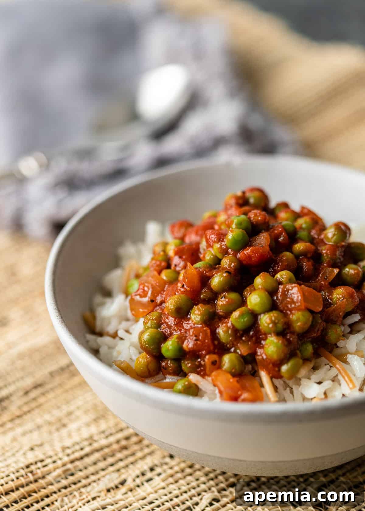 a bowl of Egyptian pea stew over rice and vermicelli