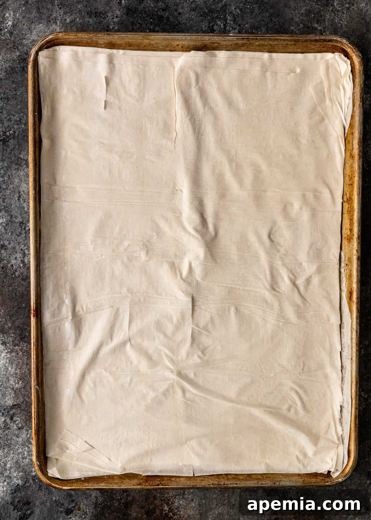Sweet Greek Baklava Made Simple 7 layer sheets of phyllo in a greased pan