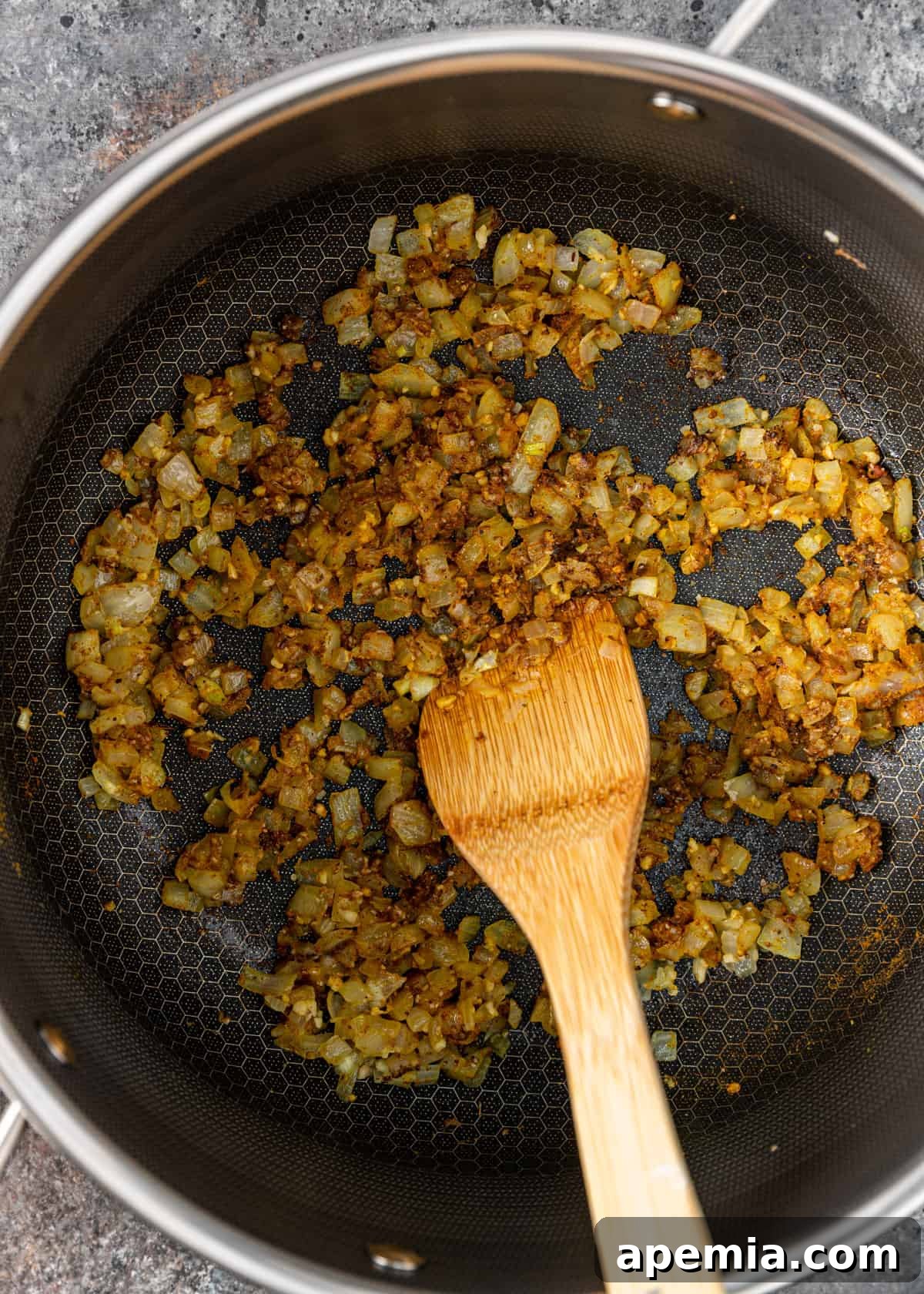 overhead view of sautéing onion and garlic