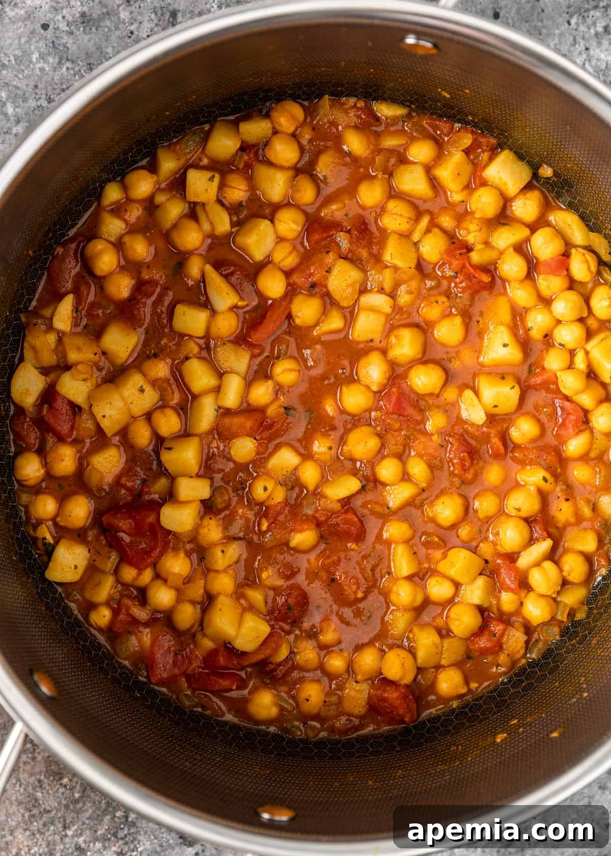 overhead view of a pot of chickpea curry