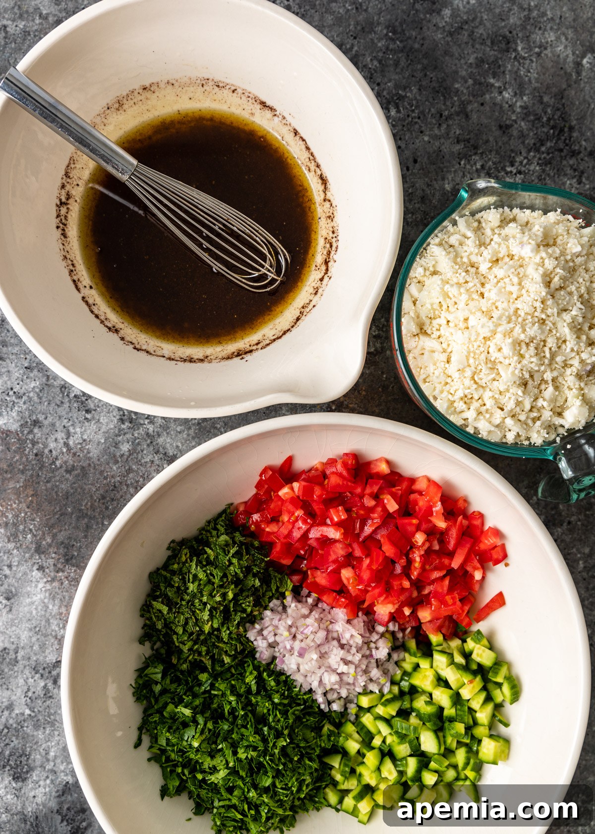 overhead: preparing the dressing and other ingredients for cauliflower tabbouleh