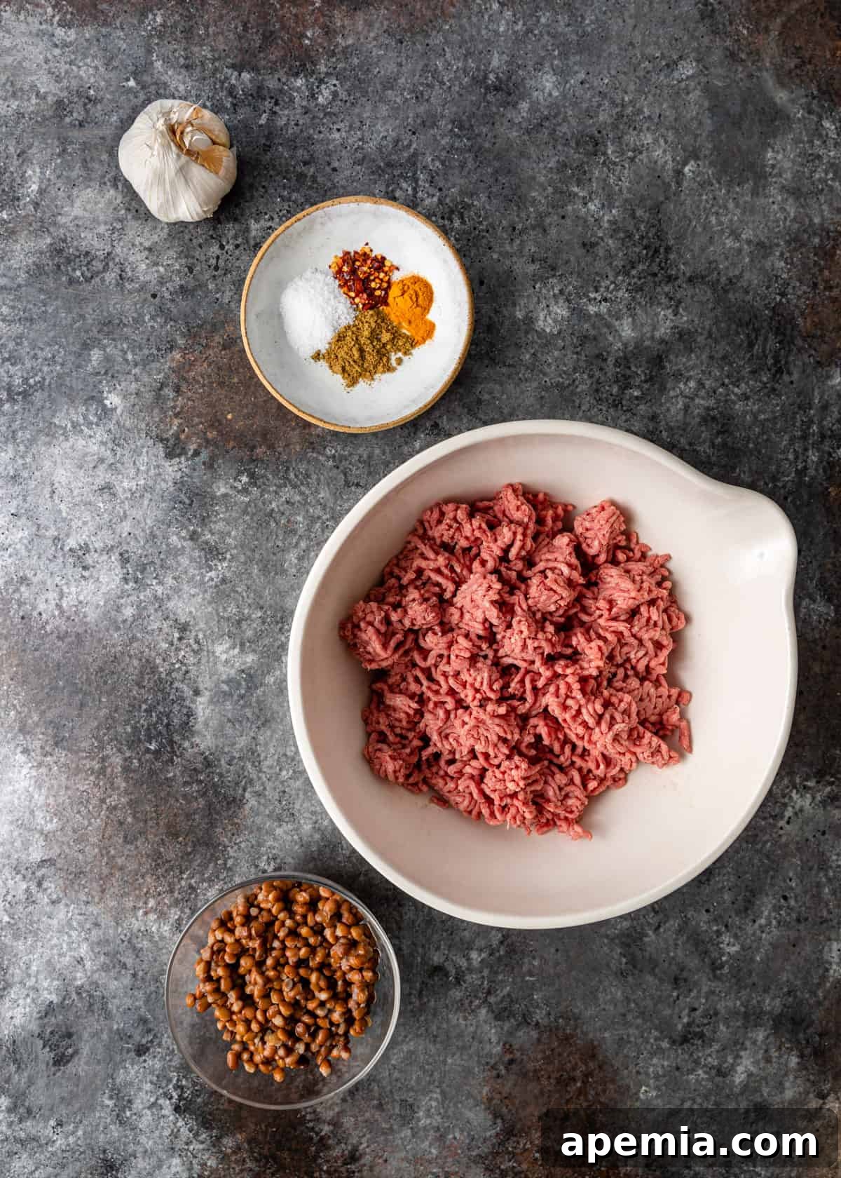 Mediterranean Lamb Lentil Meatballs and Zesty Lemon Rice 4 Overhead shot of all ingredients required for lentil lamb meatballs laid out on a clean surface.
