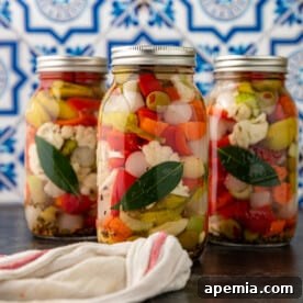 Close-up of a jar of giardiniera, showcasing the colorful vegetables and brine, ready for serving.