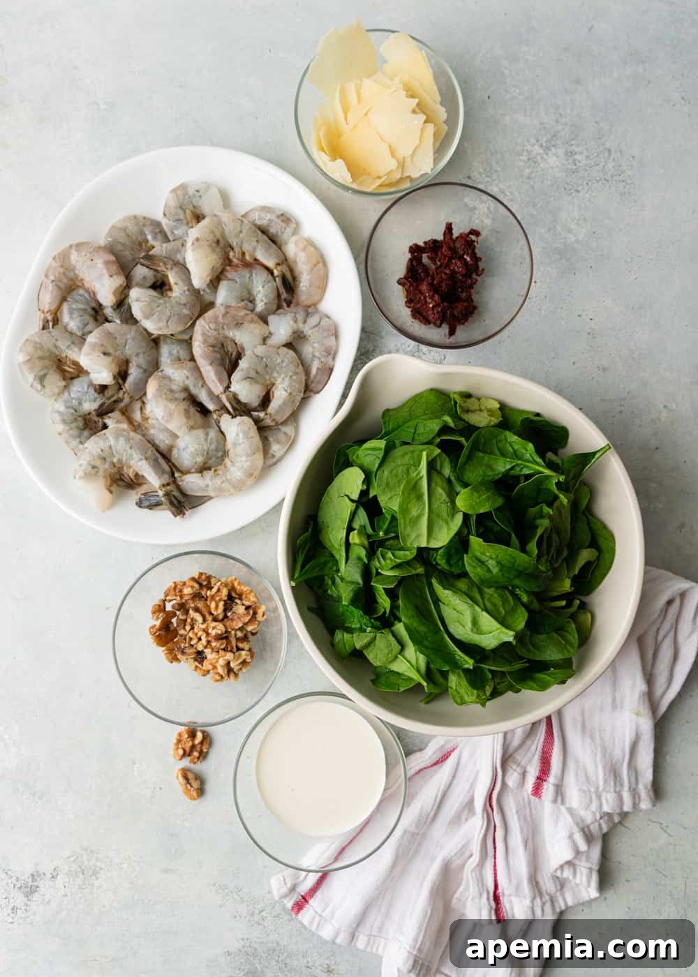 Overhead shot showing all the fresh ingredients meticulously arranged for this exquisite Tuscan shrimp recipe.