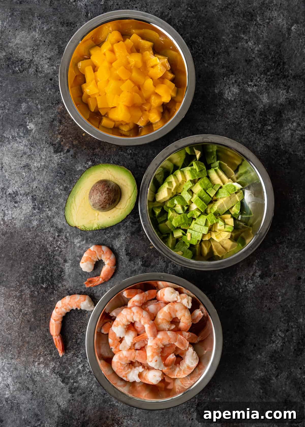 Overhead shot of all fresh ingredients laid out for preparing shrimp sushi stacks
