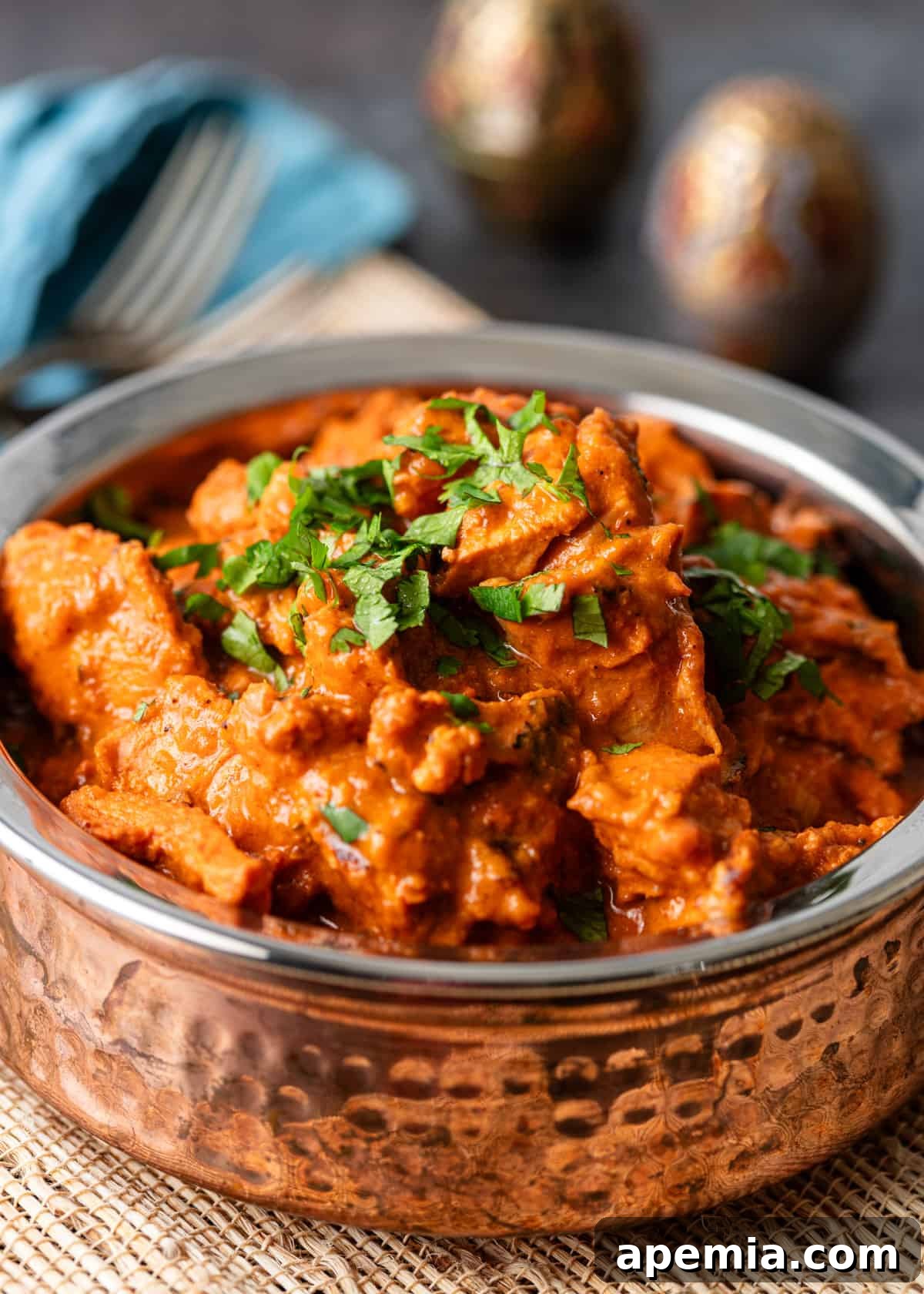 closeup: a serving of my chicken tikka masala recipe in a metal bowl