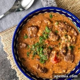 Kharcho (Georgian Beef Soup) in a bowl with herbs