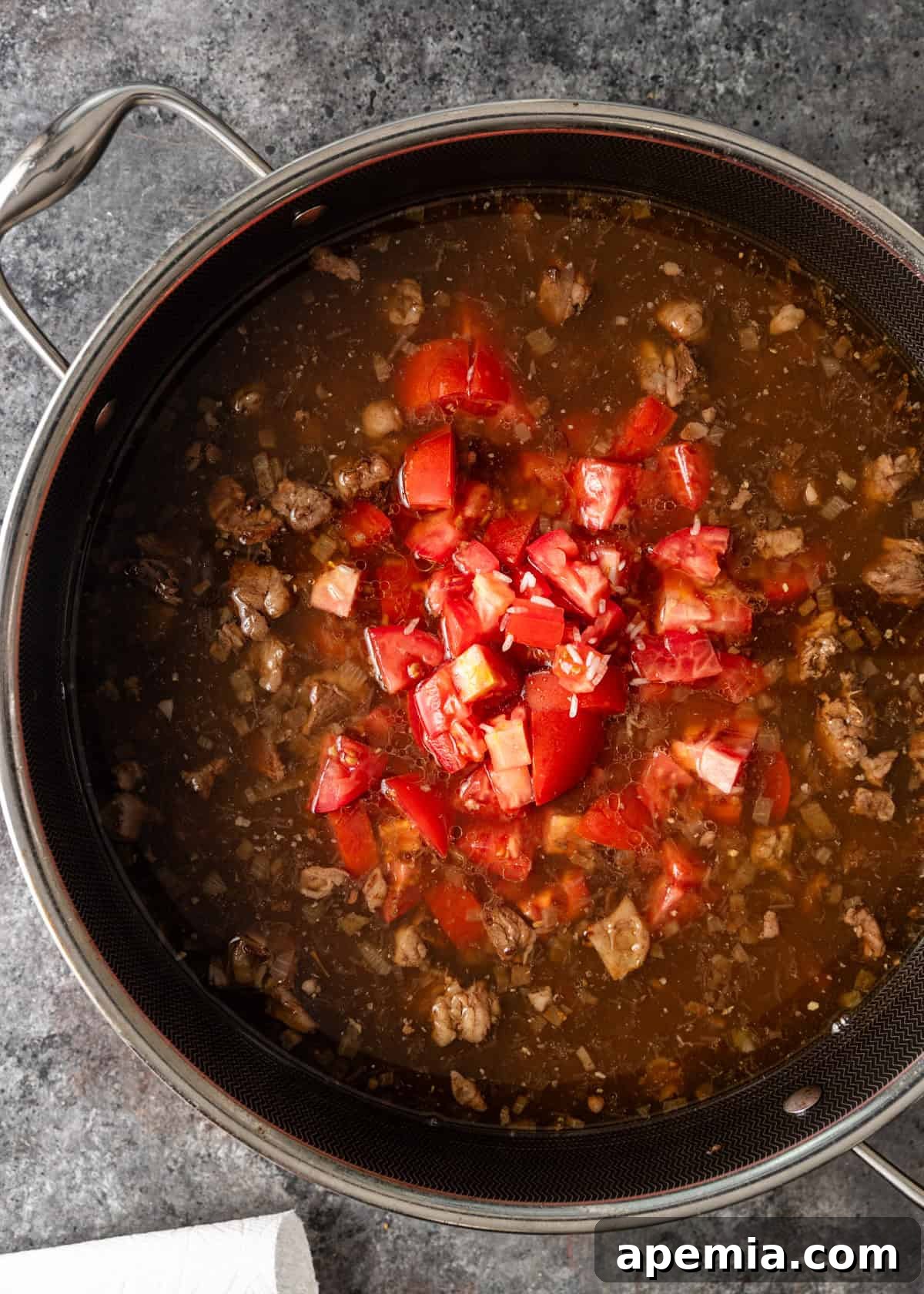 overhead: tomatoes added to the cooked beef