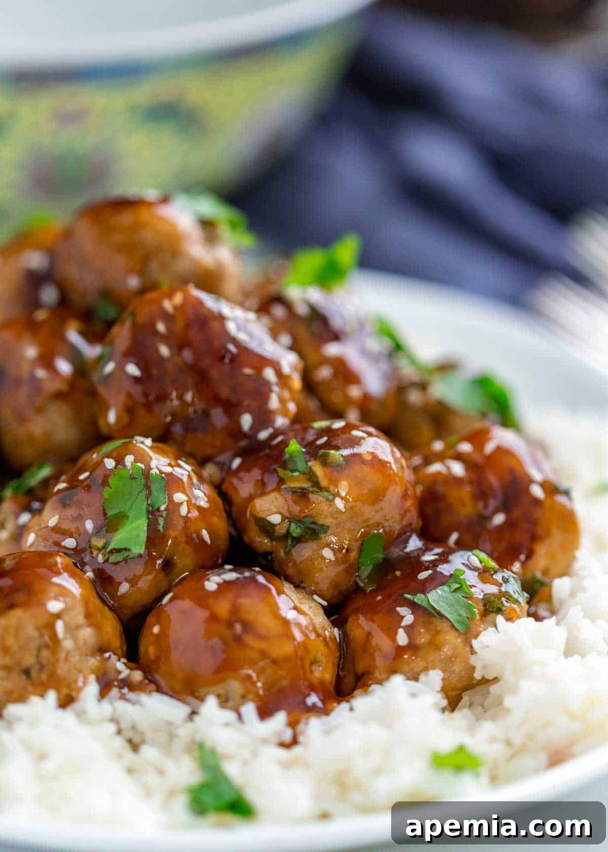 closeup: turkey meatballs with glaze on top of white rice