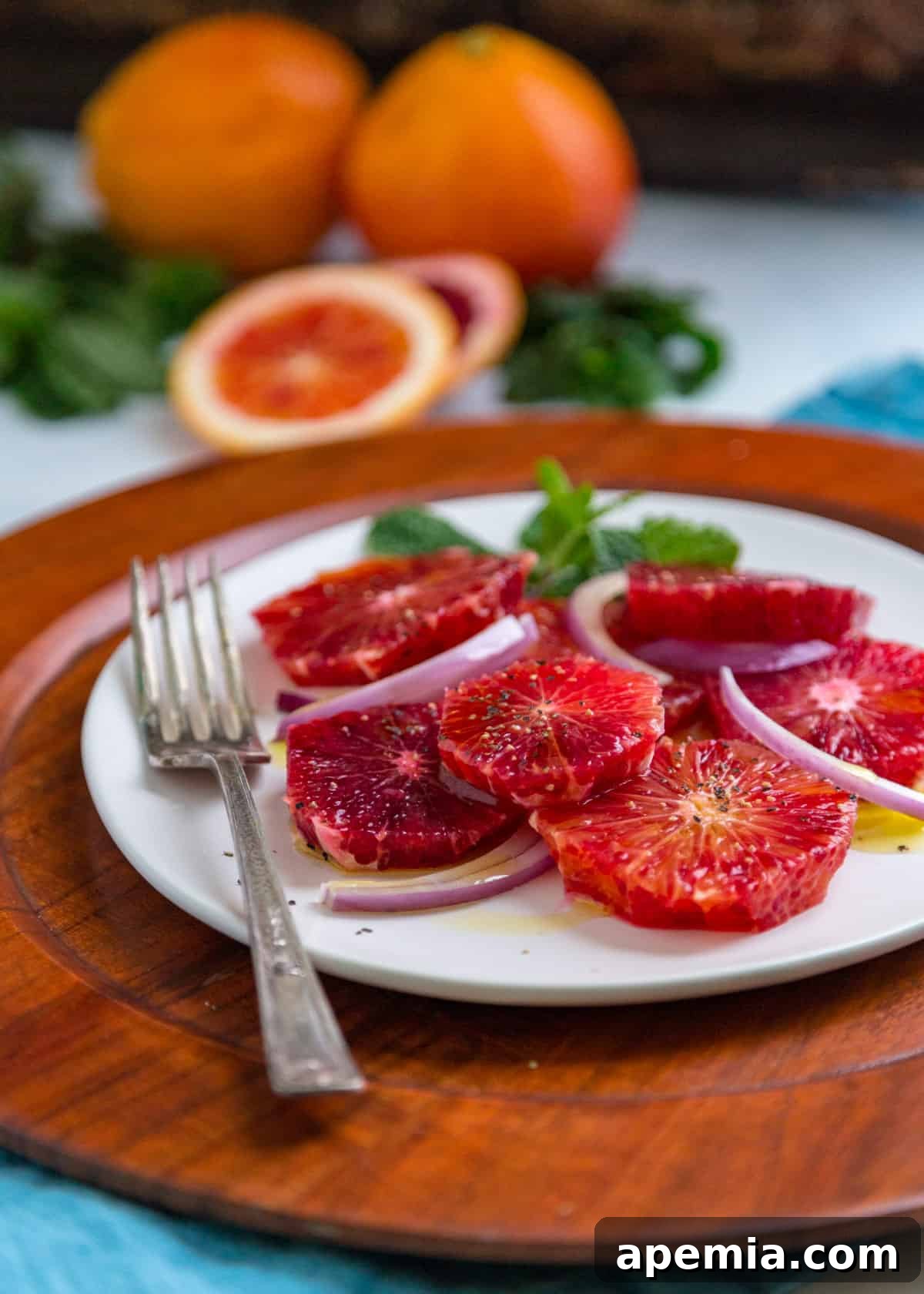 My blood orange salad recipe served on a white plate with a fork beside it, highlighting its inviting presentation.
