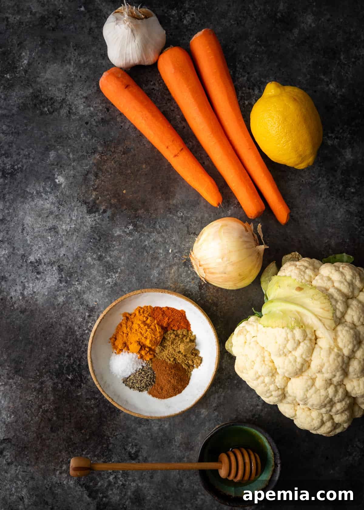 Moroccan Cauliflower and Carrot Tagine 4 Overhead view of all the fresh ingredients needed for this vegetable tagine recipe, meticulously laid out.