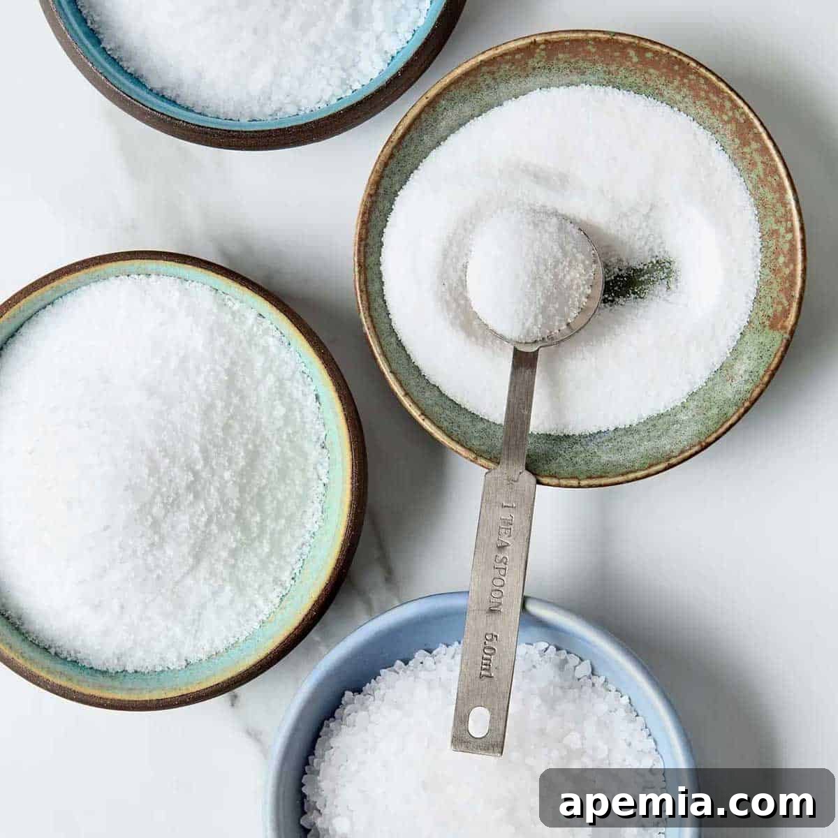 close up of bowls of different salts
