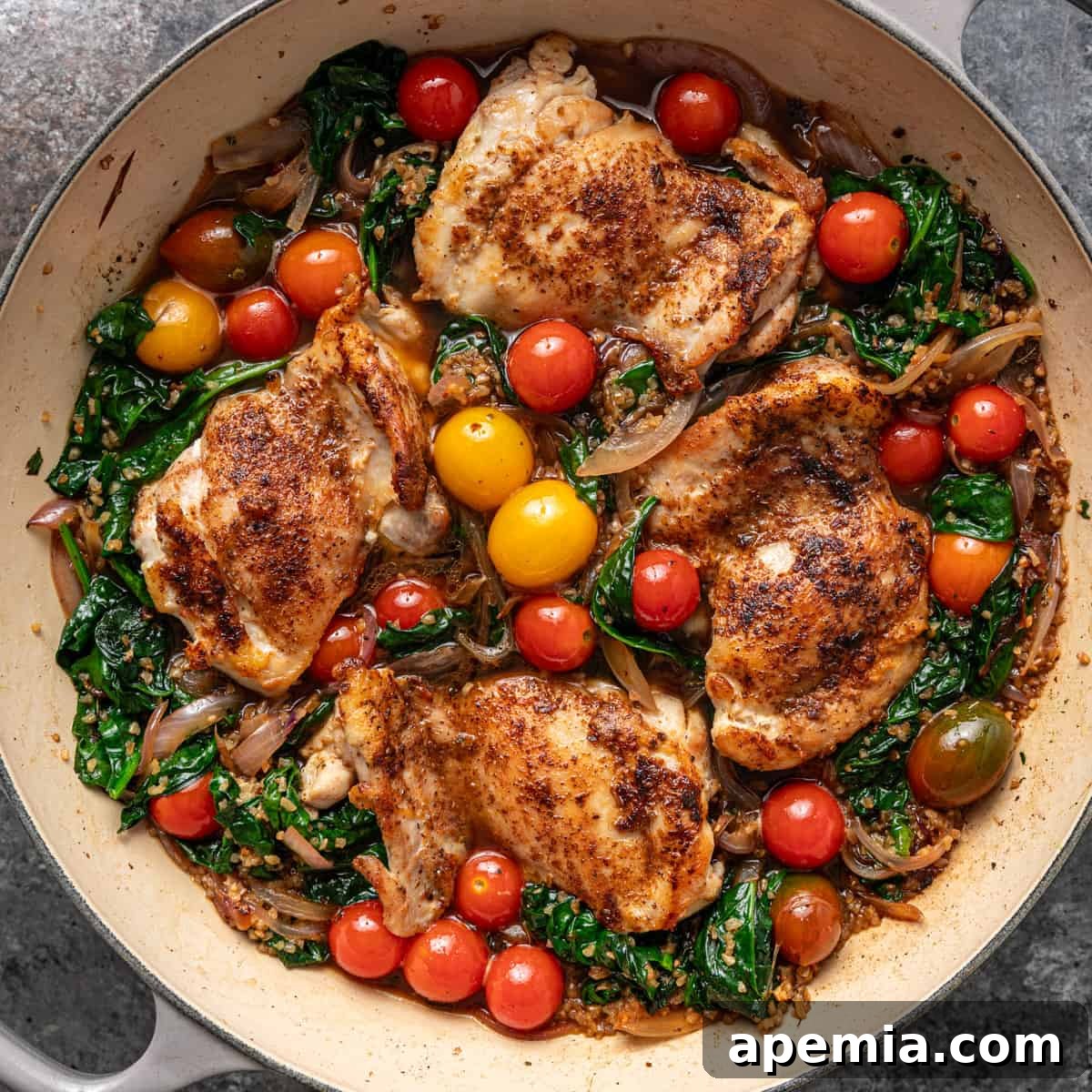 Overhead shot of Turkish chicken cooking in a skillet, showcasing golden-brown chicken, bulgur, and vibrant vegetables, ready to be served.