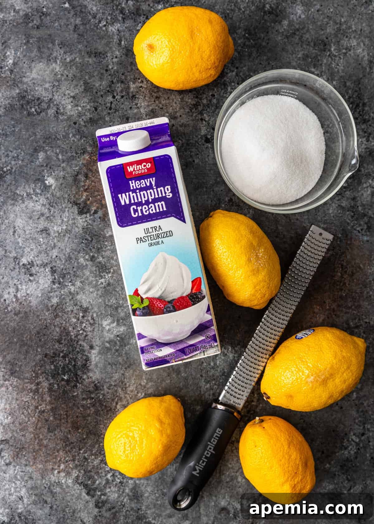 Zesty Creamy Lemon Posset 4 Overhead shot showcasing the simple ingredients needed for lemon posset: heavy cream, sugar, and lemons.